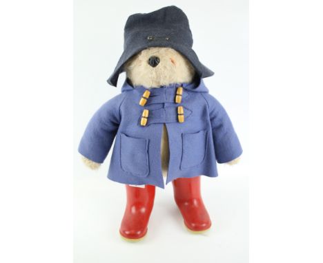 A vintage Paddington Bear Gabrielle Designs soft toy. Handmade, with Dunlop red welly boots and blue felt duffel coat. H46cm