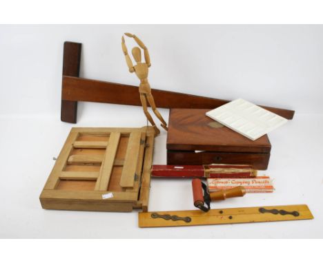 A collection of assorted vintage artist's accessories. Including a Winsor &amp; Newton mahogany box and a white ceramic paint