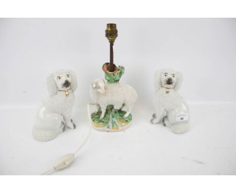A pair of Staffordshire spaniels and a Derby style lamp base. Lamp in the form of a ram, H28cm