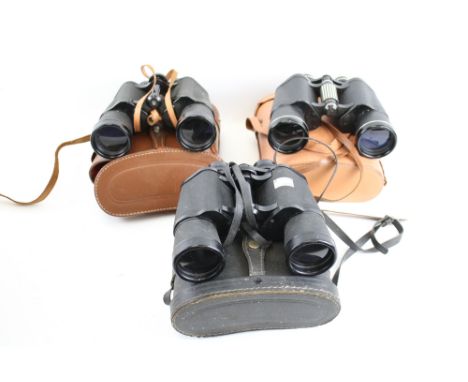 Three pairs of vintage binoculars cased. Including Prinz 10 x 50, Halina 10 x 50 and Zenith 16 x 50. 