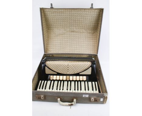 A vintage Hohner Verdi V piano accordion in case. With leather straps, L57cm x D47cm x H26cm Condition Report: Appears to be 