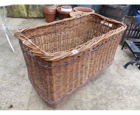 A VINTAGE LOG BASKET.