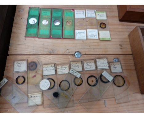 A BAUSCH AND LOMB MICROSCOPE IN MAHOGANY CASE, A SMALL COLLECTION OF MICROSCOPE SLIDES, A WALL SHELF ETC. 
