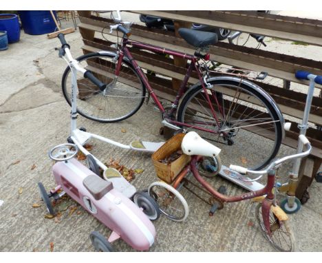 A GENTS BICYCLE, A SCOOTER, A VINTAGE TRICYCLE, A RIDE ON TOY SPORTS CAR, AND A FURTHER SCOOTER. 