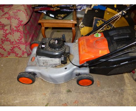 A FLYMO LAWN MOWER WITH BRIGGS &amp; STRATTON PETROL ENGINE.