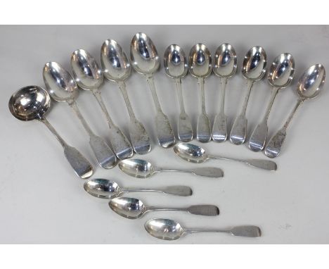 A collection of Victorian silver fiddle pattern spoons including six dessert spoons, four tablespoons, five teaspoons, and a 