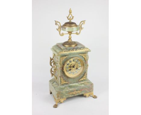 A French gilt metal mounted green onyx mantel clock with vase surmount, gilt metal dial in rectangular case with scroll side 