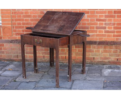 A George III mahogany architect / artist's table, the hinged moulded edge top on a ratchet, with rest on a hook and spring me