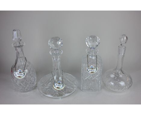 A cut glass ship's decanter, three spirit decanters, and three Crown Staffordshire porcelain decanter labels, Port, Whisky an