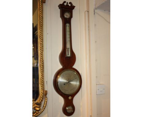 A 19th century walnut cased banjo barometer, maker G Silvani, Worthing, with four silverised dials, 98cm