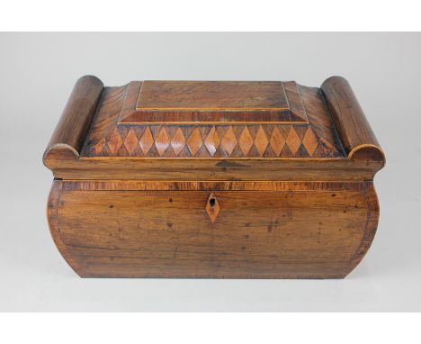 A 19th century marquetry inlaid sarcophagus tea caddy, with lion ring handles, on lion paw feet (a/f - one broken, all detach