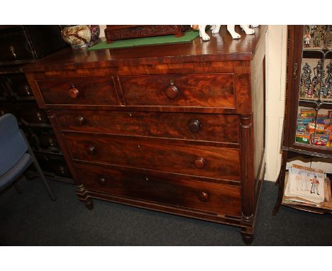 A Victorian mahogany chest of two short over three long drawers with knob handles, reeded column uprights on reeded feet, 119