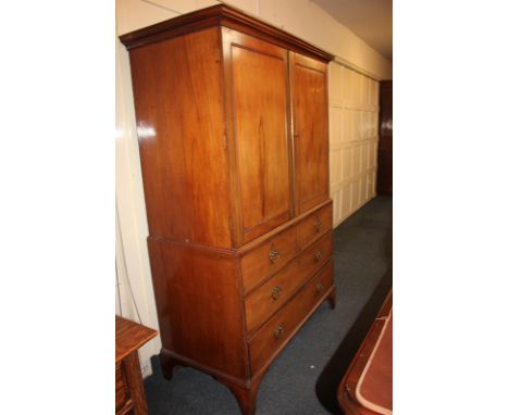 A 19th century press cupboard with moulded cornice, twin doors enclosing four sliding shelves, on associated base with two sh