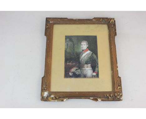 A 19th century portrait of a cavalry officer standing beside desk, by repute Charles Grant as a young man, 16cm by 11cm