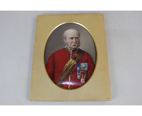 A 19th century military portrait on porcelain, believed to be Lord Roberts of India, in red military tunic with sash and meda