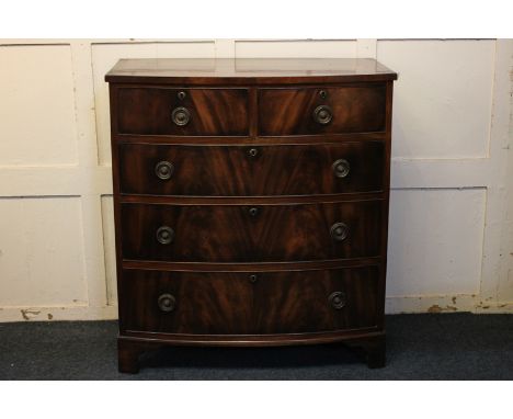 A mahogany bow-front chest of two short over three long drawers, on bracket feet, 91cm