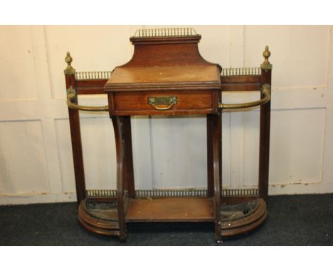 A Victorian James Shoolbred &amp; Co brass mounted oak hall stand with balustrade, central shelf and drawer with makers mark,