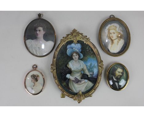 A 19th century portrait miniature of a lady wearing a pearl necklace, in oval gilt metal frame, 8.5cm by 6.5cm, together with