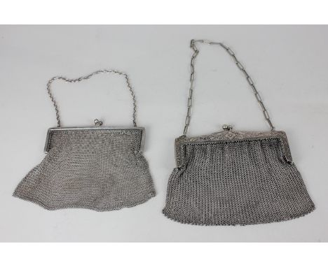 A George V silver cocktail mesh bag with clasp and chain, London 1926, and another similar with floral decoration, marked Met