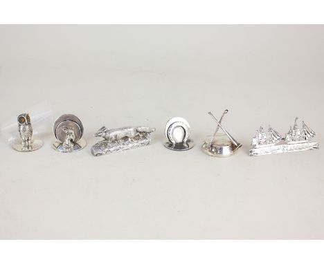 A collection of six Edward VII and later novelty silver place setting holders including one in the form of a fox, R G Garrard
