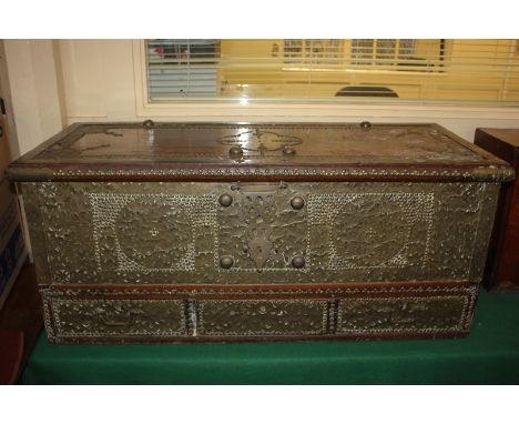 A Continental hardwood mule chest, heavily studded and brass bound, with lifting rectangular lid and three drawers, 111cm