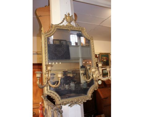 A giltwood and gesso girondelle wall mirror with urn and harebell surmount and a pair of three-light candle holders, mirror p