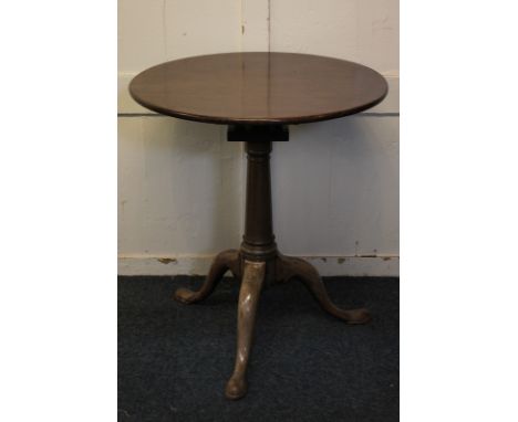 A George III mahogany circular side table, with tilt top on later bird cage support on tapered stem and tripod base, 61cm