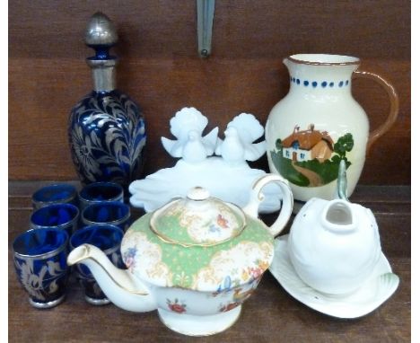 A Torquay motto ware jug, a Paragon teapot, a blue glass liqueur set, Shorter & Son sauce boat and a dish