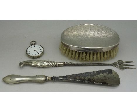 A silver backed brush, bangle, fob watch, shoe horn and toasting fork