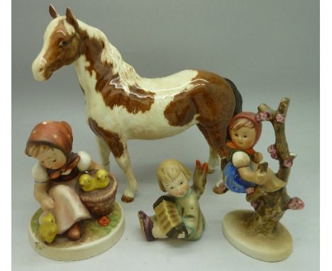 Three Goebel/Hummel figures, one a/f, and a Beswick Pinto Pony, a/f