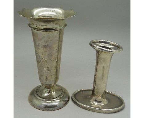 A silver candlestick and vase, height of vase 14cm