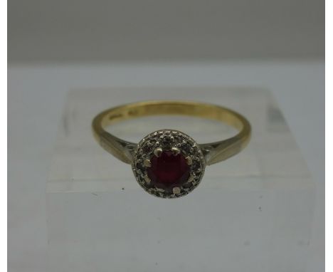 An 18ct gold, ruby and diamond ring, weight 3.2g, size O