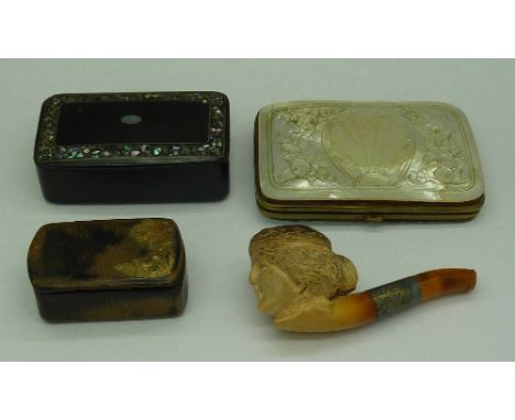 A carved mother of pearl purse, two papier mache snuff boxes and a carved silver mounted pipe