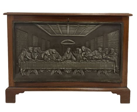 Mahogany storage box, the lifting lid over base with campaign handles and a depiction of The Last Supper, raised on bracket s