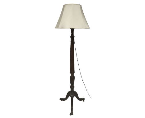 20th century standard lamp, with one turned and reeded column leading into three splayed supports, terminating in brass hairy