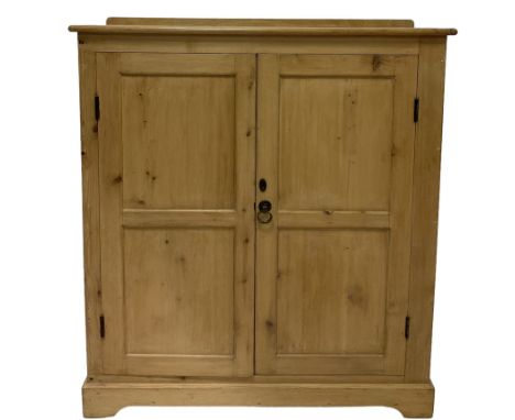 19th century pine cupboard, the raised back over two cupboard doors, opening to reveal three fixed shelves, raised on bracket