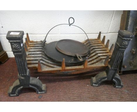 Iron grate and fire dogs together with a skillet and pan 