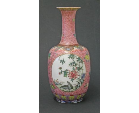 A Chinese porcelain bottle vase bearing Qianlong seal, height 34cm. Condition - drilled to accommadate lamp fitting, small ch
