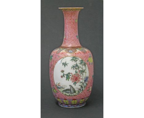 A Chinese porcelain bottle vase bearing Qianlong seal, height 34cm. Condition - drilled to accommadate lamp fitting, small ch