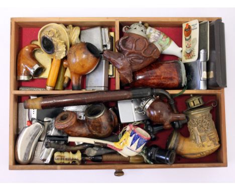 A mixed lot of smoking related items including pipe bowls, pipes and lighters etc