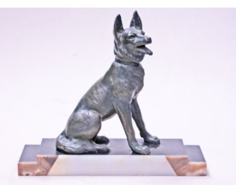An Art Deco bronze dog on onyx base, height 30cm. Condition - general wear to include minor chips to base.