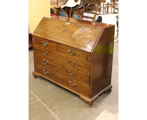 A Georgian mahogany bureau with ogee bracket feet. W125cm D54cm H106cm