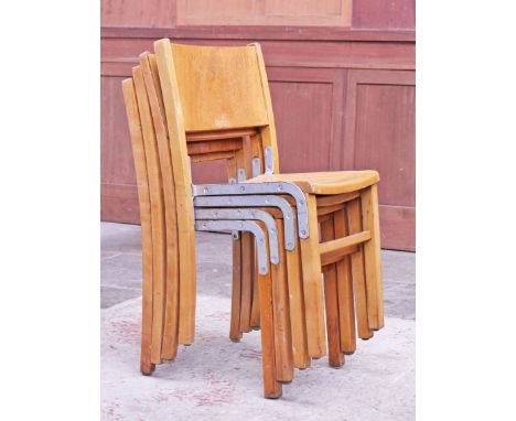 A set of four light wood stacking chairs. H76cm each