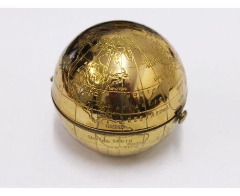 A vintage Pygmalion globe compact
