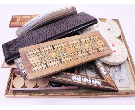 An embroidered print and a collection of cribbage boards