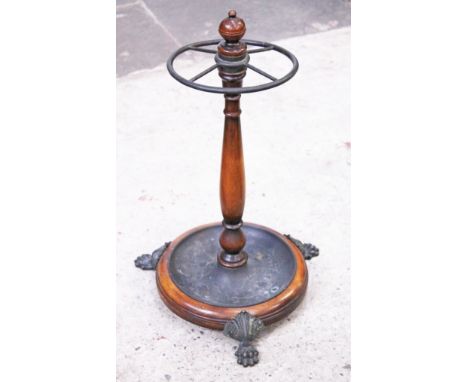 A reproduction mahogany stick stand with cast claw feet. H60cm