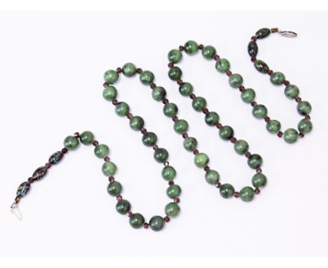 A string of jade beads, length 72cm, gross wt. 84.3g