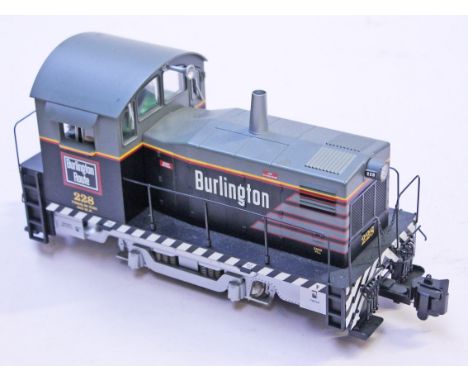 Three model trains comprising a Bachmann large scale locomotive and tender, a USA Trains and an Aristo-Craft. Condition - app