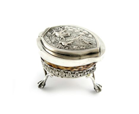 A 19th century silver-mounted cowrie shell snuff box, unmarked, the hinged cover embossed with a hunting scene, on a Victoria