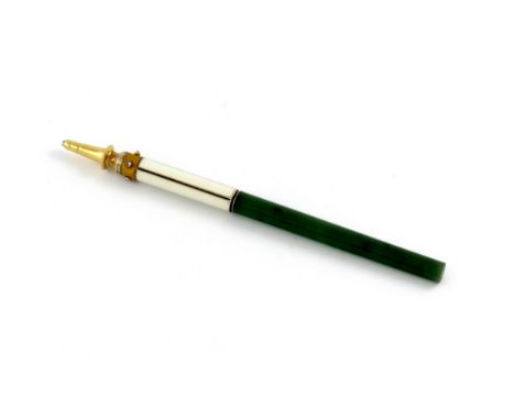 A gold, enamel and nephrite pencil, with a worn mark, probably Russian, with white and yellow enamel decoration and set with 